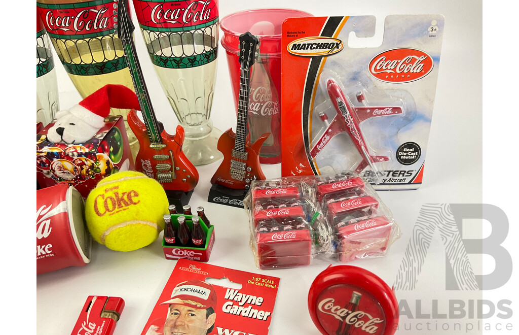 Collection of Coca Cola Collectables Including Cigarette Lighters, Cups, Christmas Ornaments and More