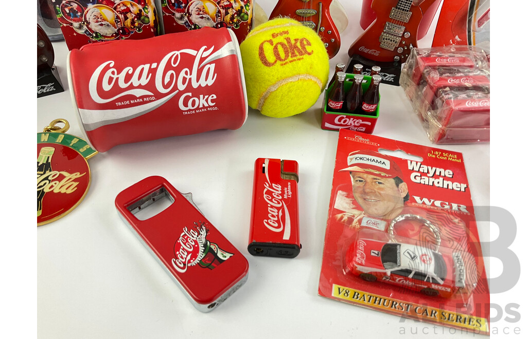 Collection of Coca Cola Collectables Including Cigarette Lighters, Cups, Christmas Ornaments and More