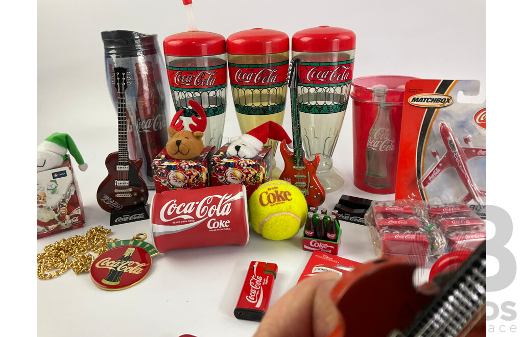 Collection of Coca Cola Collectables Including Cigarette Lighters, Cups, Christmas Ornaments and More