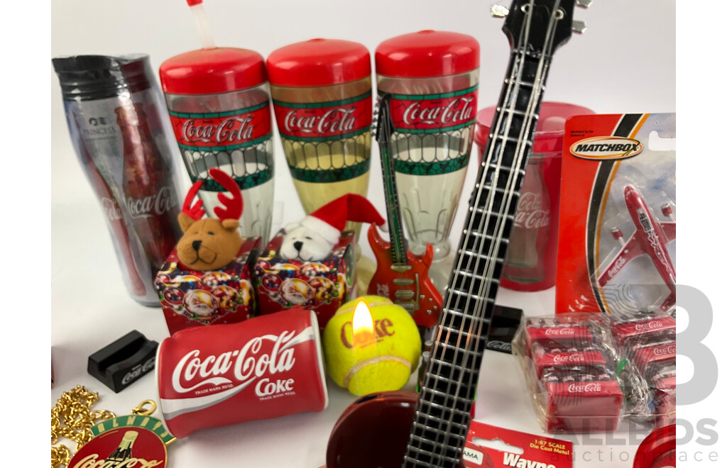 Collection of Coca Cola Collectables Including Cigarette Lighters, Cups, Christmas Ornaments and More