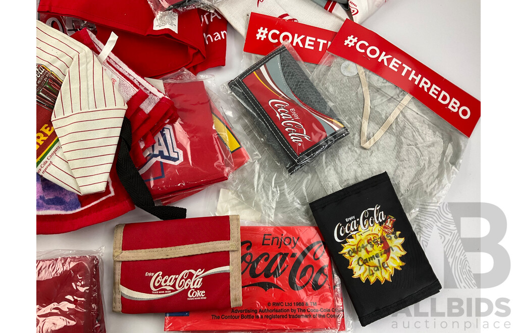 Assortment of Coca Cola Wallets, Tea Towels, Bags, Socks, Sweat Bands, Oven Mitt and Ponchos