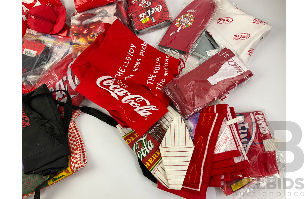 Assortment of Coca Cola Wallets, Tea Towels, Bags, Socks, Sweat Bands, Oven Mitt and Ponchos