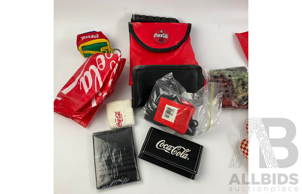 Assortment of Coca Cola Wallets, Tea Towels, Bags, Socks, Sweat Bands, Oven Mitt and Ponchos