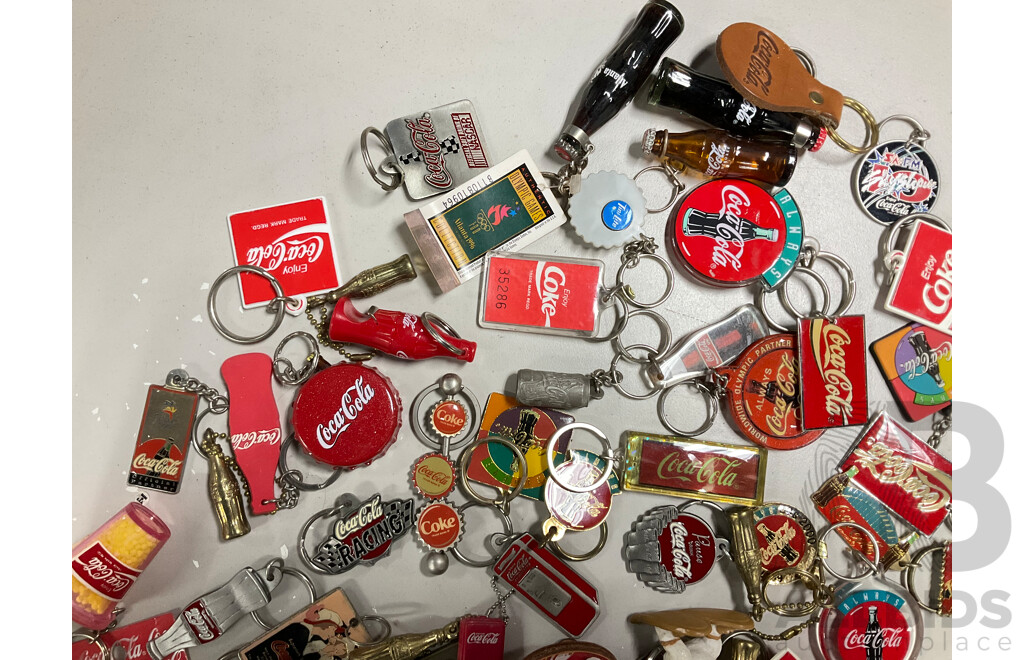 Collection of Coca Cola Keyrings Including NASCAR and Olympics