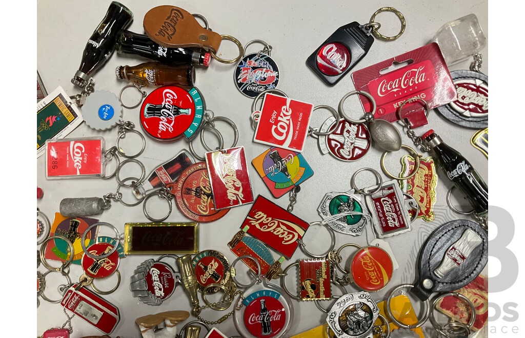 Collection of Coca Cola Keyrings Including NASCAR and Olympics