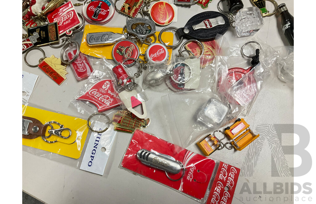 Collection of Coca Cola Keyrings Including NASCAR and Olympics