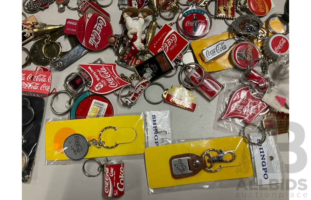 Collection of Coca Cola Keyrings Including NASCAR and Olympics