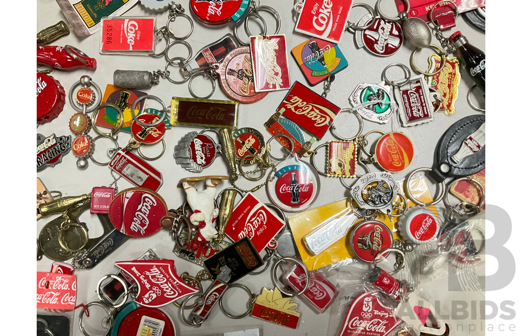 Collection of Coca Cola Keyrings Including NASCAR and Olympics