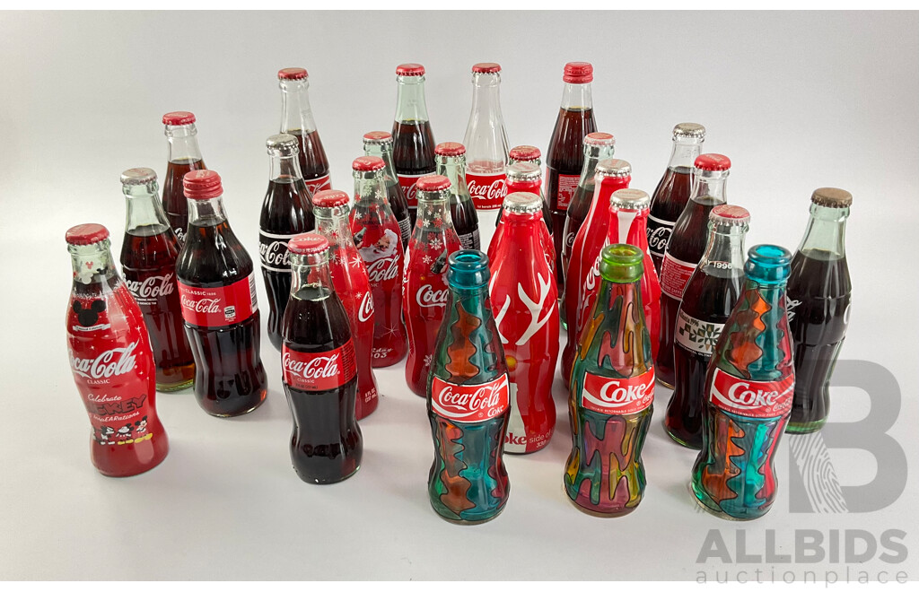 Collection of Coca Cola Glass Bottles Including Christmas and Stained Glass Examples