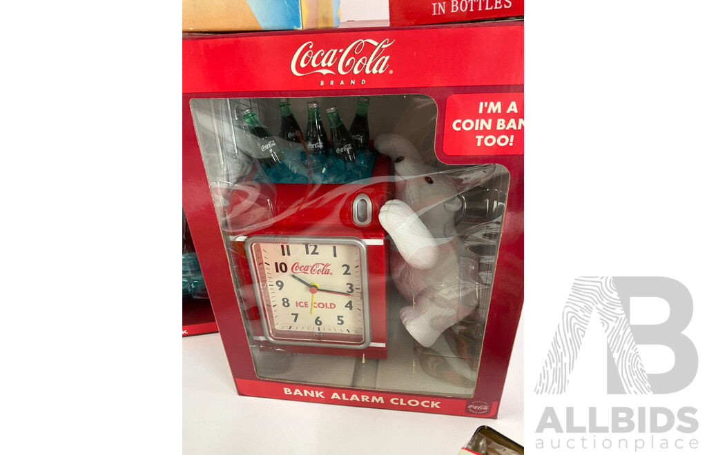 Assortment of Coca Cola Items Including Moulded Wall Clock, Bank Alarm Clock, Diecast Vehicles, Tins, Cups, Collector and Cooking Books