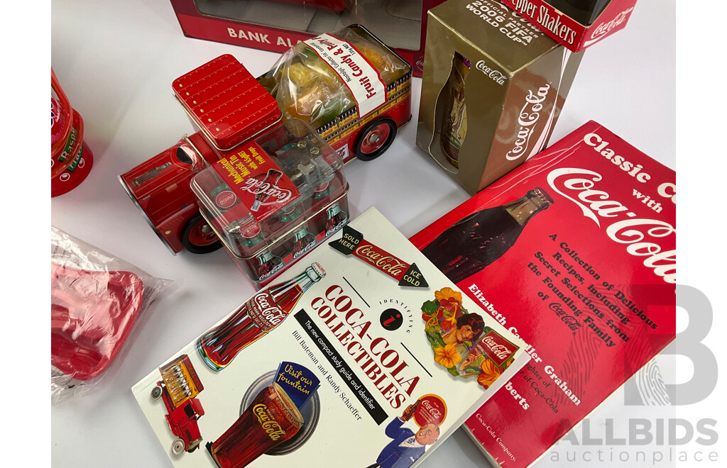 Assortment of Coca Cola Items Including Moulded Wall Clock, Bank Alarm Clock, Diecast Vehicles, Tins, Cups, Collector and Cooking Books