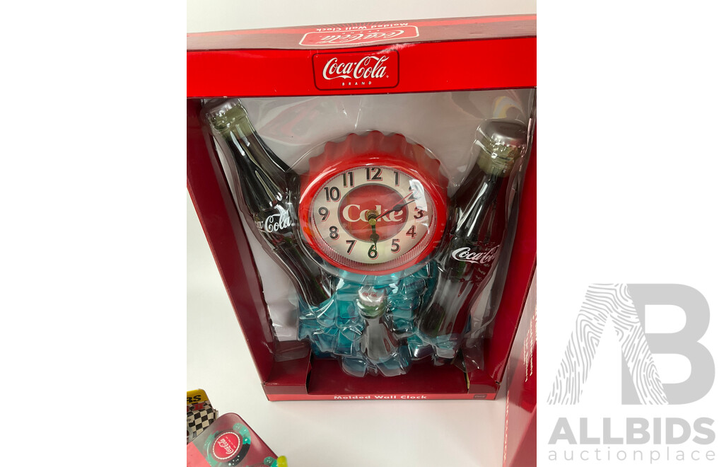 Assortment of Coca Cola Items Including Moulded Wall Clock, Bank Alarm Clock, Diecast Vehicles, Tins, Cups, Collector and Cooking Books