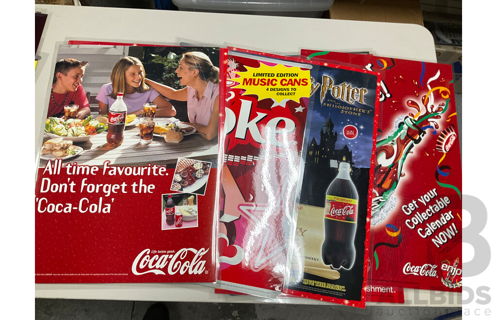 Twenty Laminated Coca Cola Retail Promotion/Advertisement Posters Including Christmas, Cherry Coke, Harry Potter, Beach is Calling and More