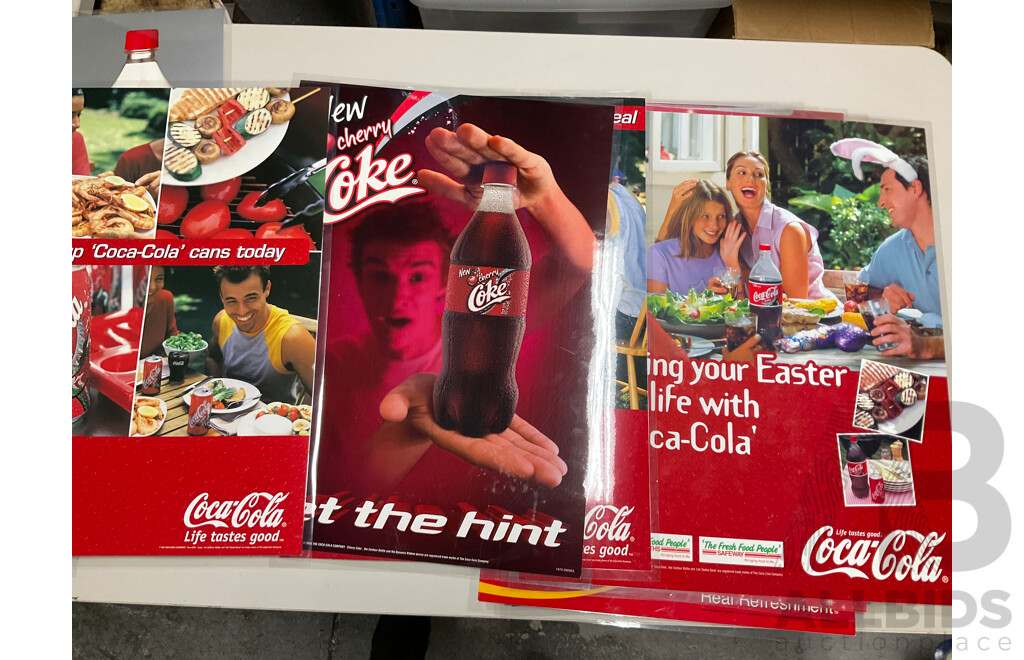 Twenty Laminated Coca Cola Retail Promotion/Advertisement Posters Including Christmas, Cherry Coke, Harry Potter, Beach is Calling and More