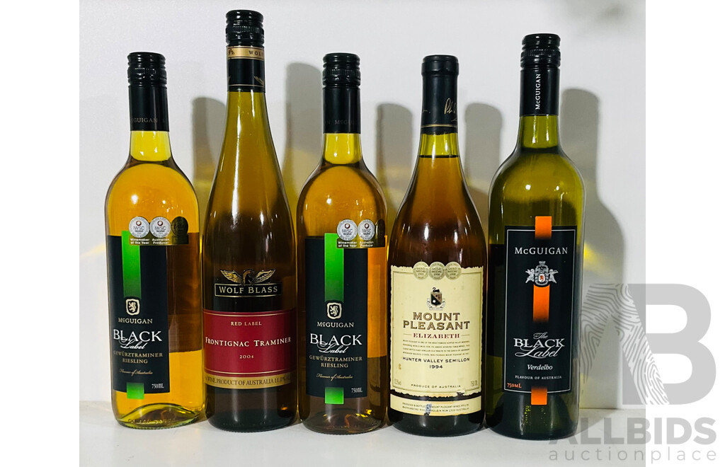 Five Bottles of Various White Wines