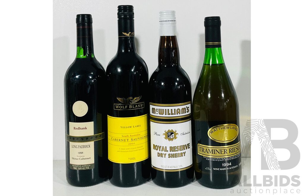 Four Bottles of Various Red Wines