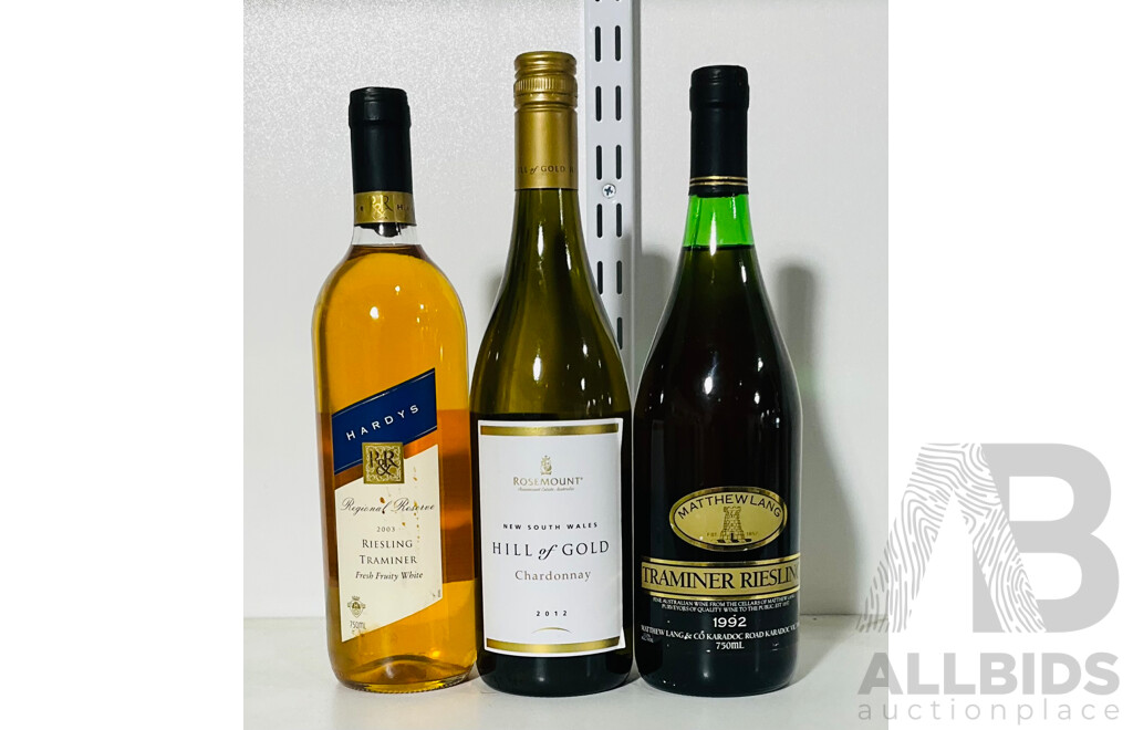 Three Bottles of Various White Wines