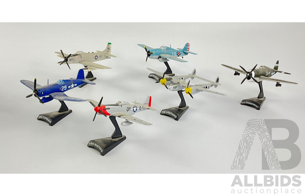 Six Diecast Military Propeller Aircraft on Display Stands Including F4U Corsair, P51D Mustang, P-47 Thunderbolt, A-1Hskyraider, F4F Wildcat, P-38 Lightning