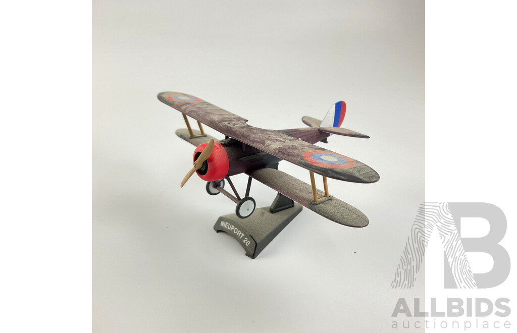 Three Diecast WW1 Era Aircraft on Display Stands Including Sopwith F-1 Camel, Fokker DR-1, Nieuport 28