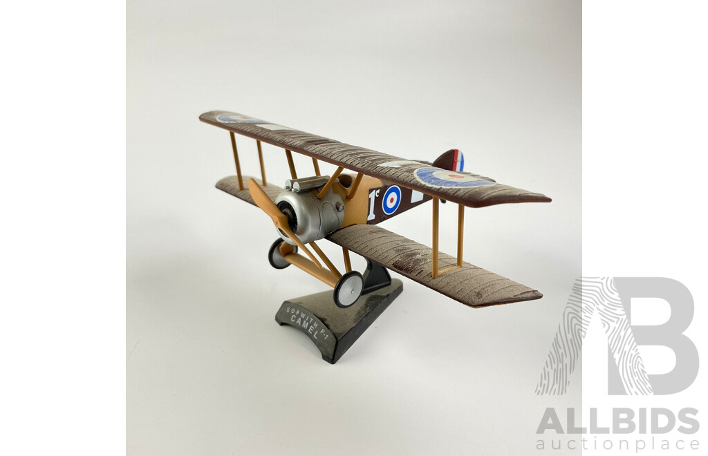 Three Diecast WW1 Era Aircraft on Display Stands Including Sopwith F-1 Camel, Fokker DR-1, Nieuport 28