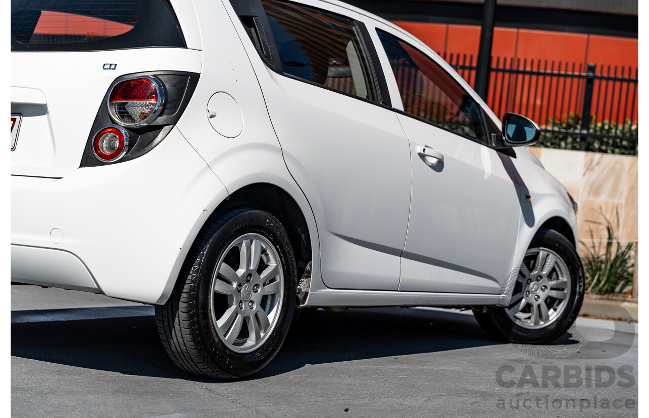 5/2013 Holden Barina CD TM MY13 5d Hatchback Summit White 1.6L