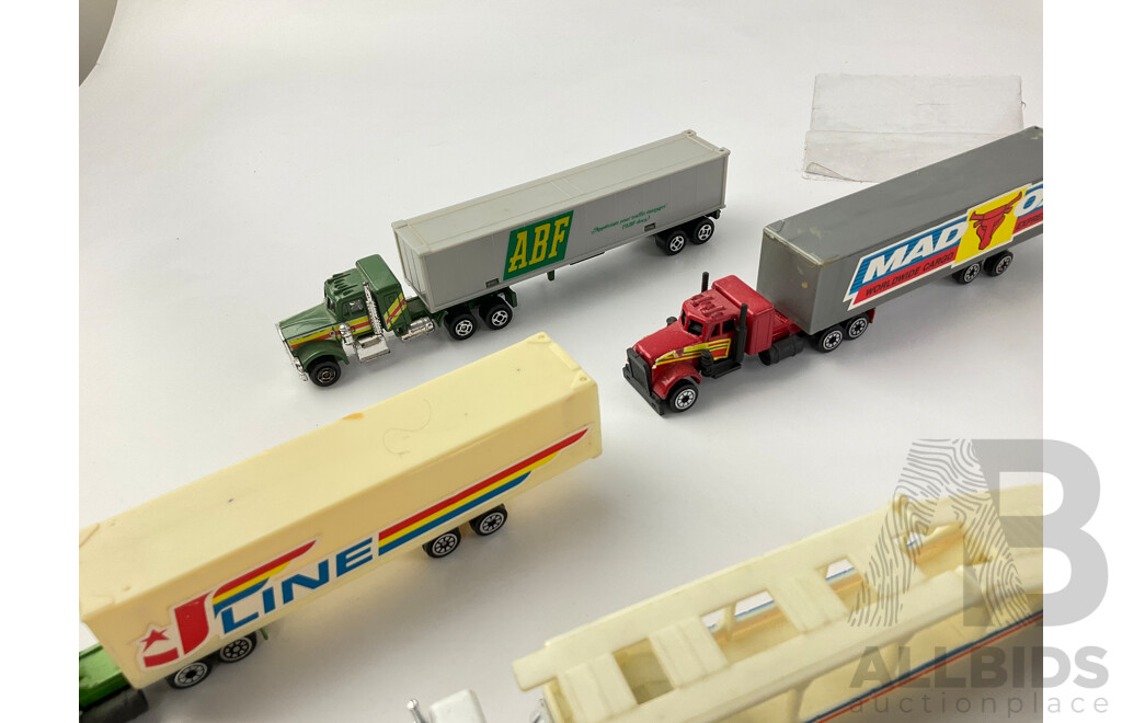 Collection of Diecast Semi Trailer Trucks Including Goodyear and Firestone