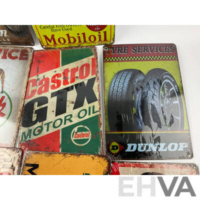 Ten Reproduction Steel Signs Including BP, Shell, Indian, Mobiloil, Champion, Mack, Castrol, Dunlop