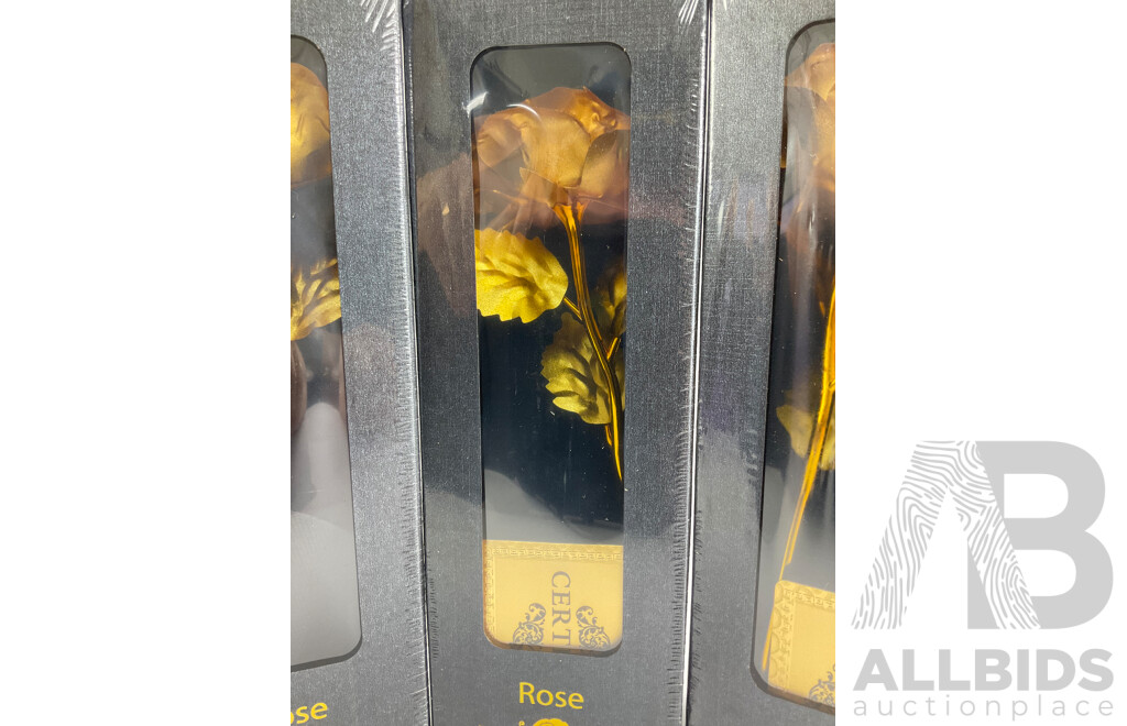 Four Boxed Gold Tone Roses