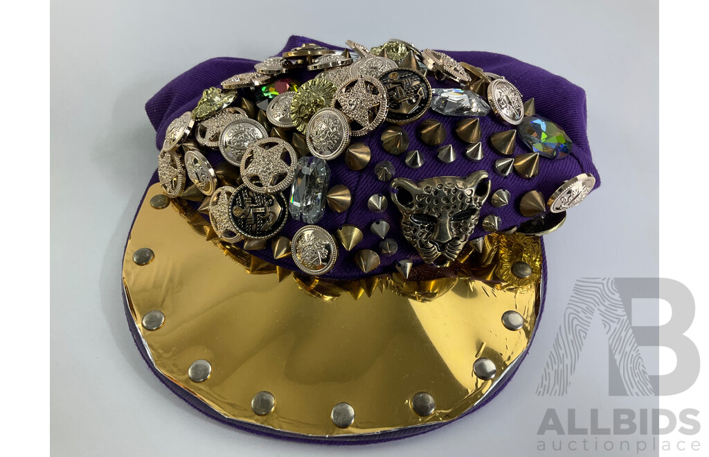 Hard Case Gold Tone Handbag Adorned with Faux Diamond and Pearls with Purple and Gold Hat with Studs and Badges