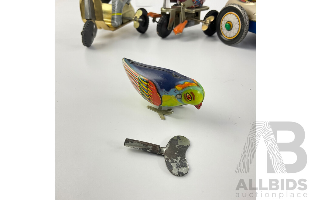 Vintage Pressed Steel Clockwork Toys Including Elephant and Duck on Tricycles, Motorcycle and Side Car, Chicken Sea Saw, Plane Carousel, Pecking Chicken, Ice Cream Cart, All Made in China with Peg Leg Tug Boat