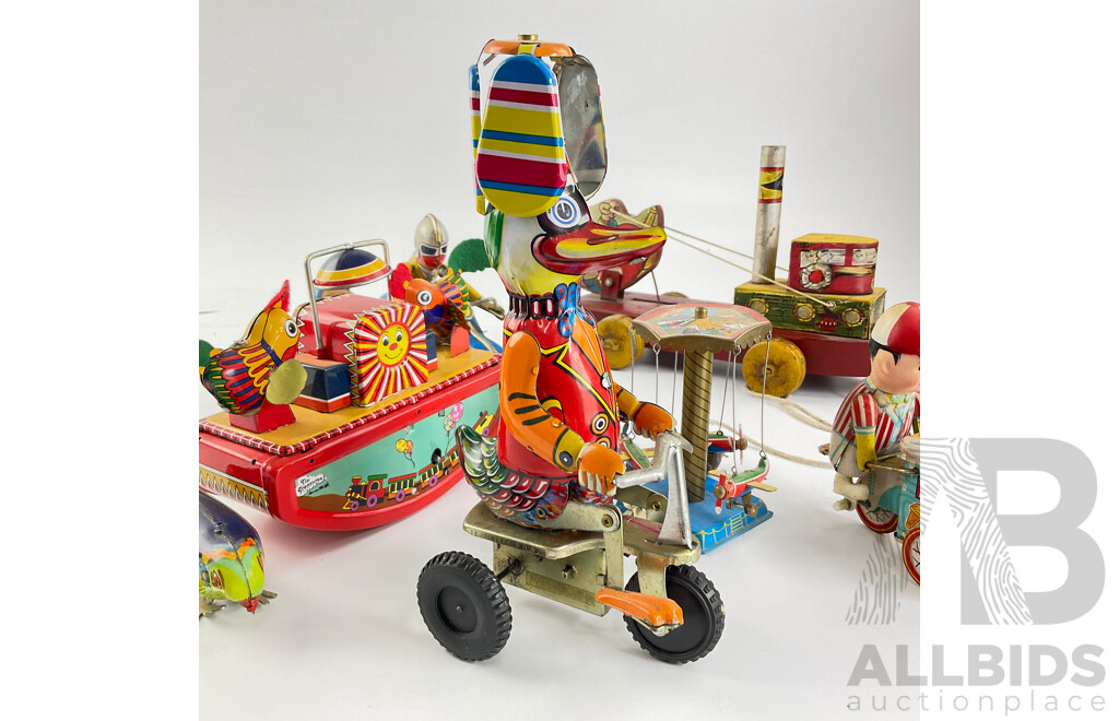 Vintage Pressed Steel Clockwork Toys Including Elephant and Duck on Tricycles, Motorcycle and Side Car, Chicken Sea Saw, Plane Carousel, Pecking Chicken, Ice Cream Cart, All Made in China with Peg Leg Tug Boat