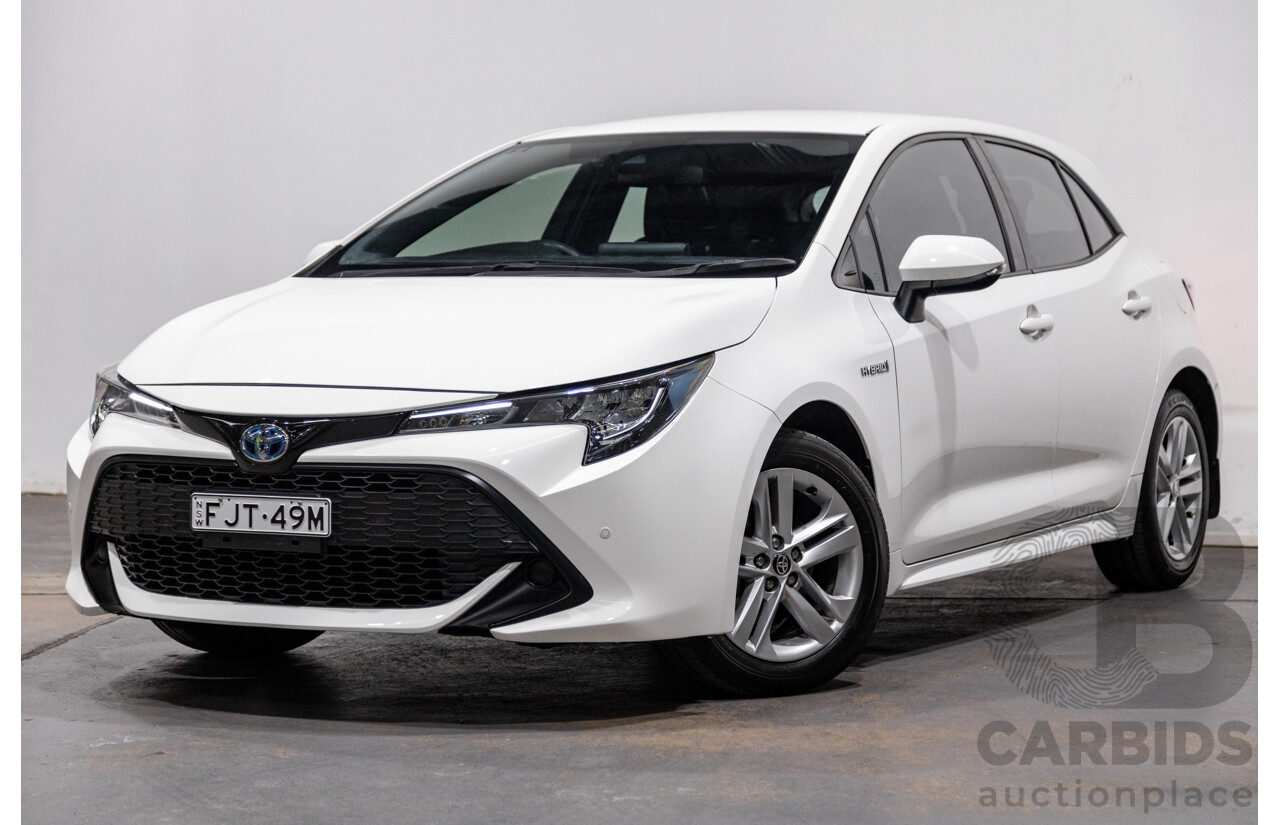 11/2020 Toyota Corolla Ascent Sport Hybrid ZWE211R MY21 4d Hatch White 1.8L / 90kW Hybrid