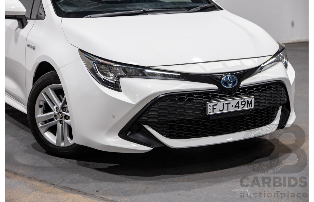 11/2020 Toyota Corolla Ascent Sport Hybrid ZWE211R MY21 4d Hatch White 1.8L / 90kW Hybrid