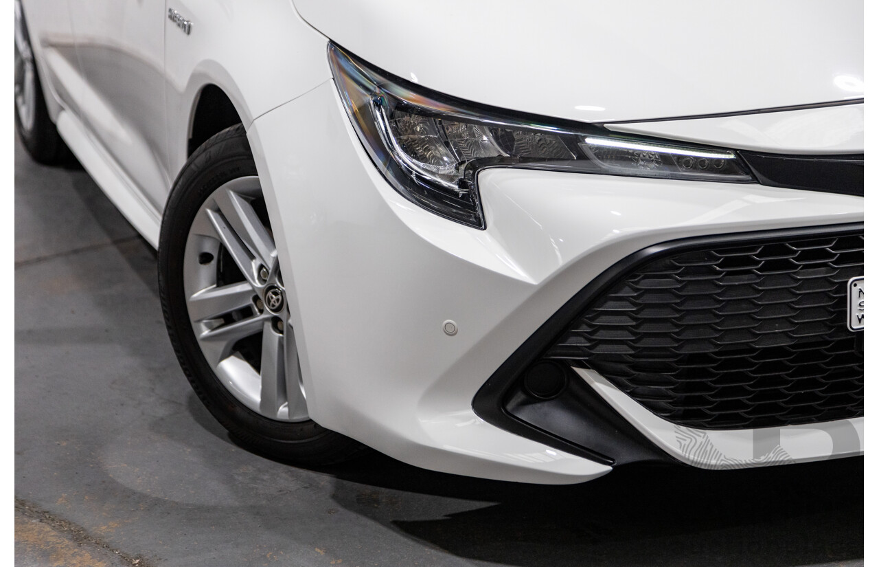 11/2020 Toyota Corolla Ascent Sport Hybrid ZWE211R MY21 4d Hatch White 1.8L / 90kW Hybrid