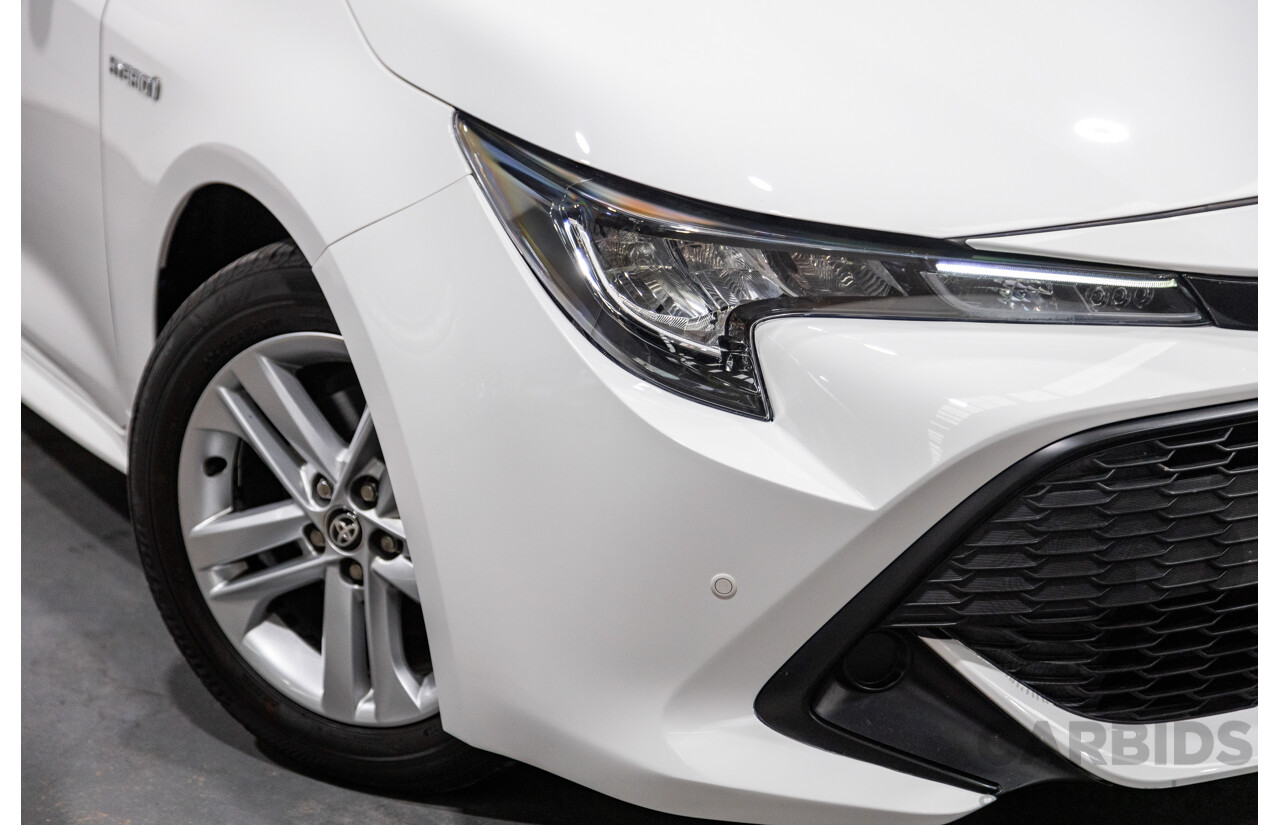 11/2020 Toyota Corolla Ascent Sport Hybrid ZWE211R MY21 4d Hatch White 1.8L / 90kW Hybrid