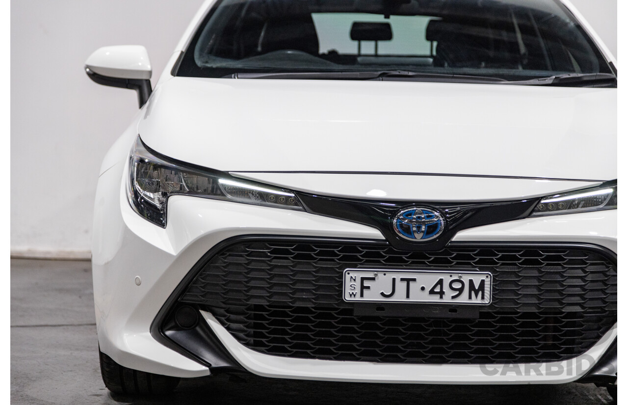 11/2020 Toyota Corolla Ascent Sport Hybrid ZWE211R MY21 4d Hatch White 1.8L / 90kW Hybrid