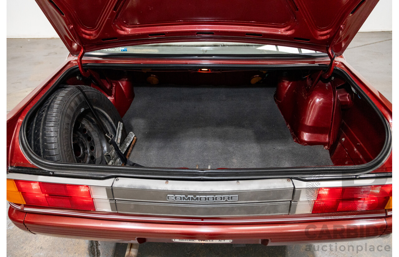 5/1988 Holden Commodore SL Executive VL BT-1 4d Sedan Venetian Red 3.0L - Ex-NSW Police