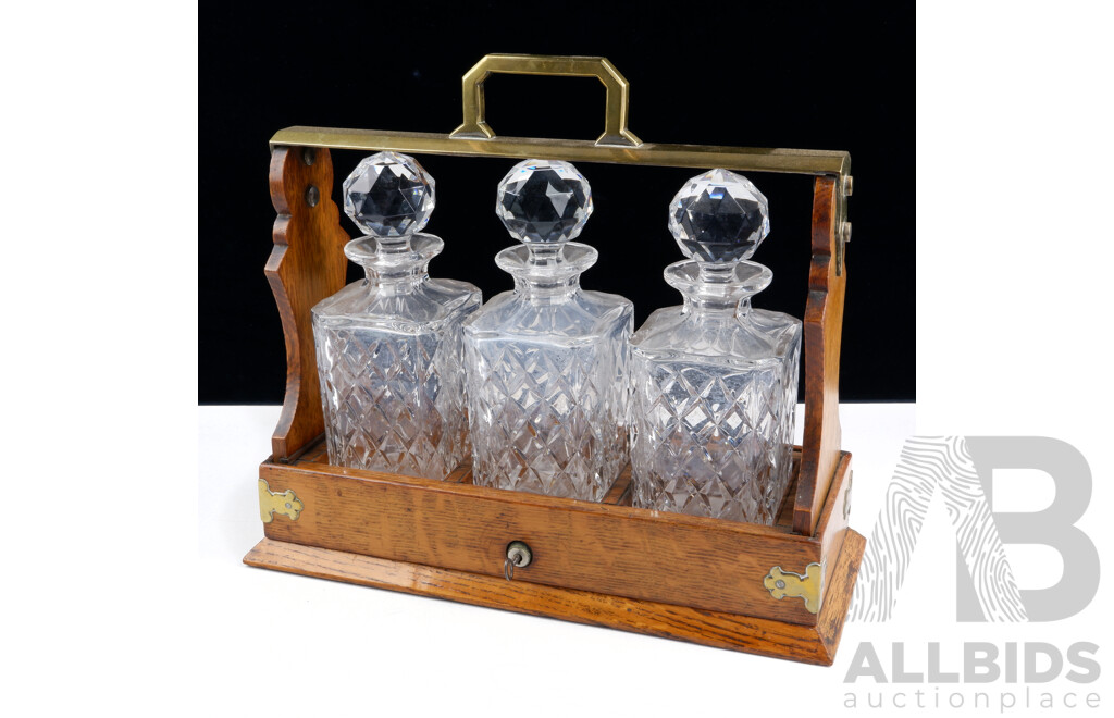 Antique Oak Tantalus with Three Glass Decanters and Stoppers with Lock and Key