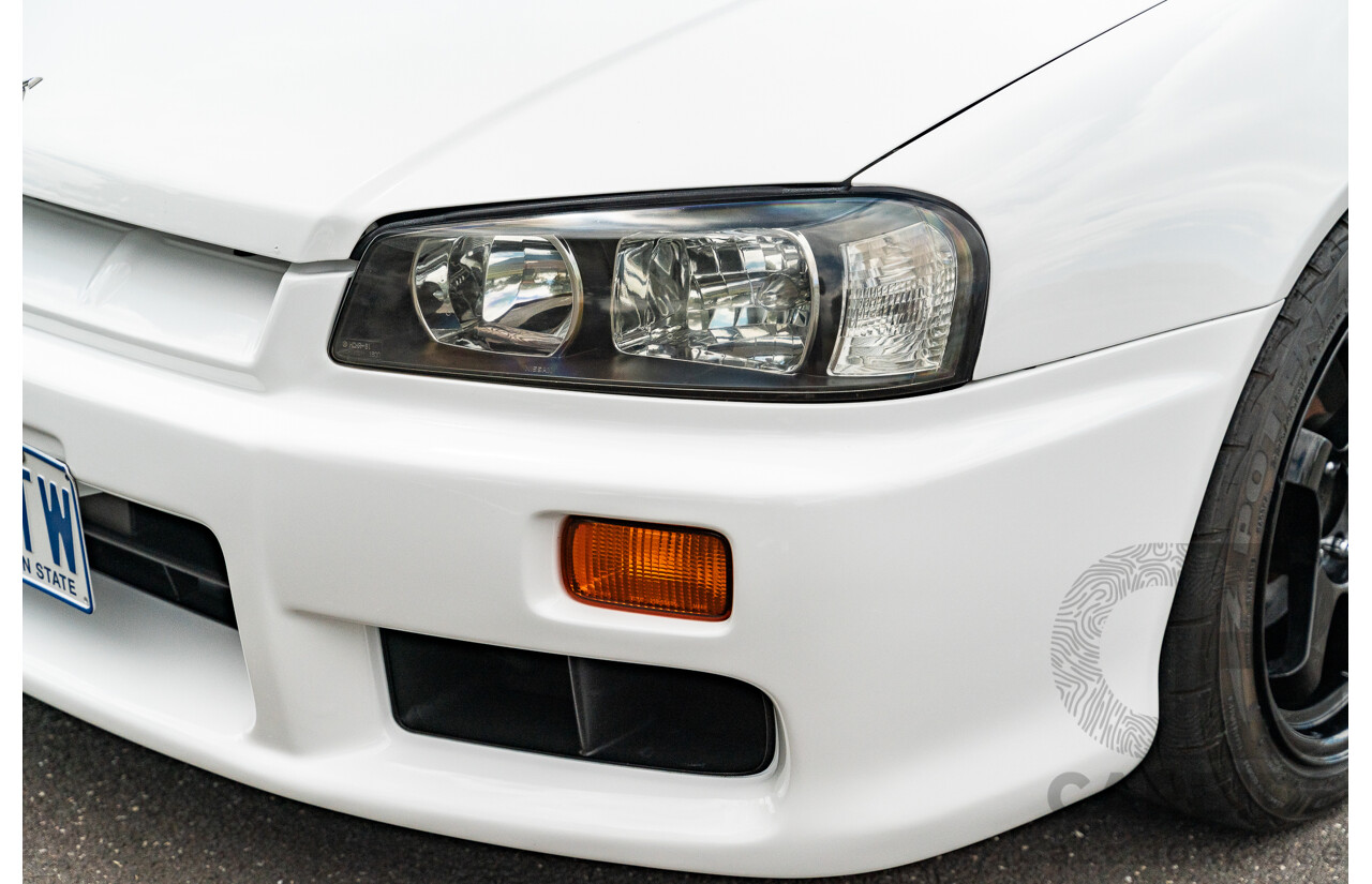 02/1999 Nissan R34 Skyline 25GT ER34 Series 1 2d Coupe QM1 White 2.5L - 04/2012 Import