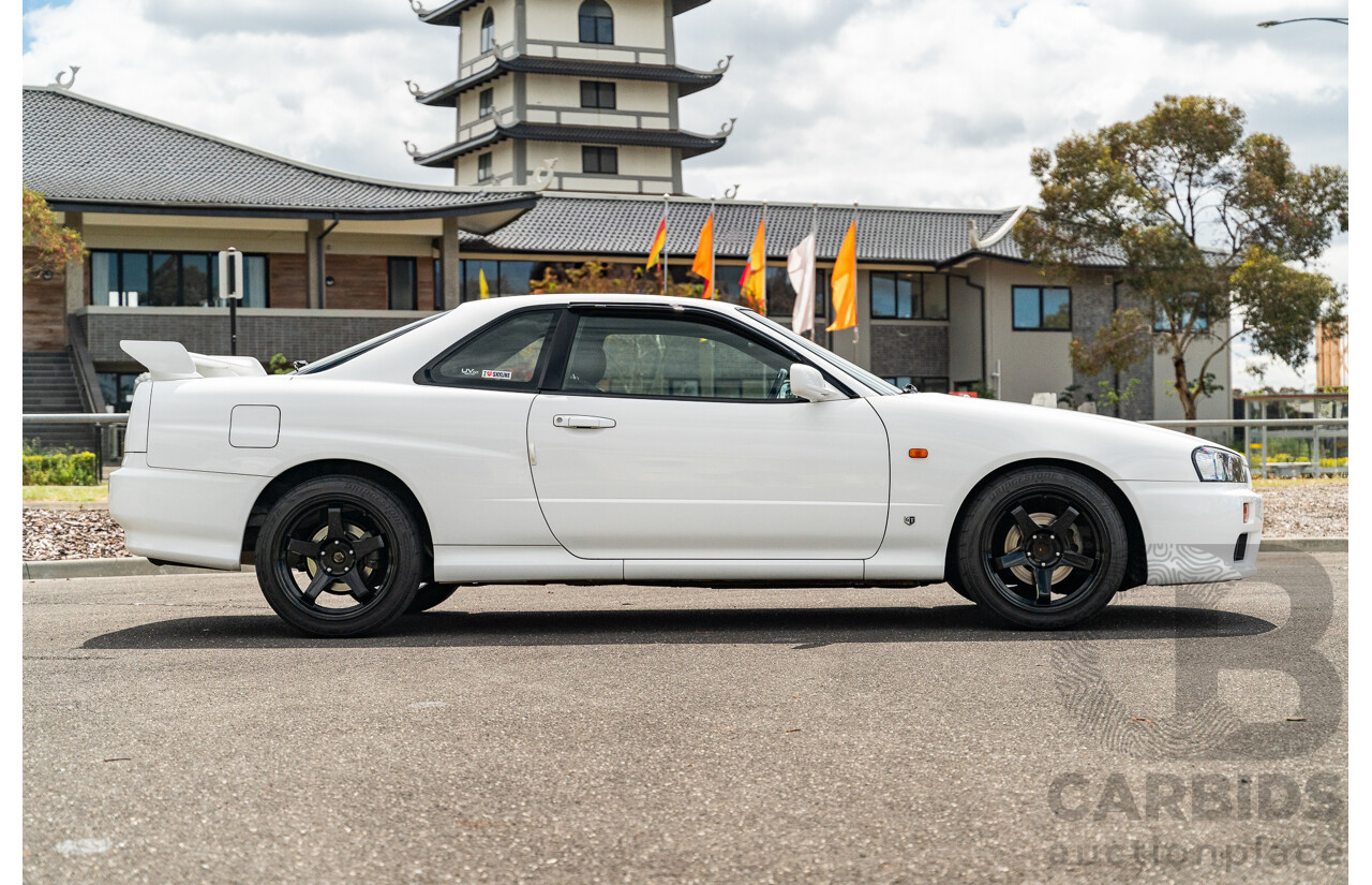 02/1999 Nissan R34 Skyline 25GT ER34 Series 1 2d Coupe QM1 White 2.5L - 04/2012 Import