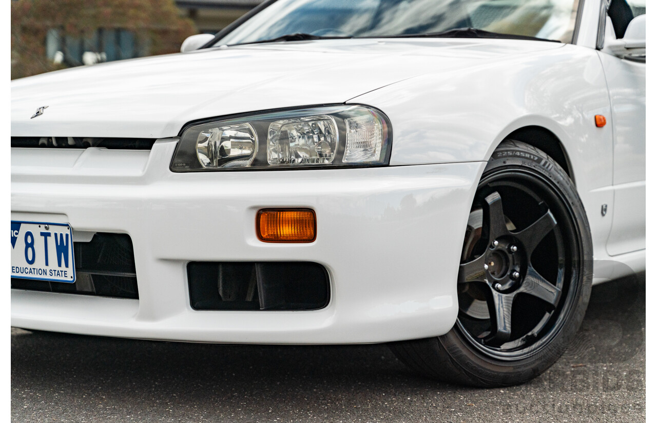 02/1999 Nissan R34 Skyline 25GT ER34 Series 1 2d Coupe QM1 White 2.5L - 04/2012 Import