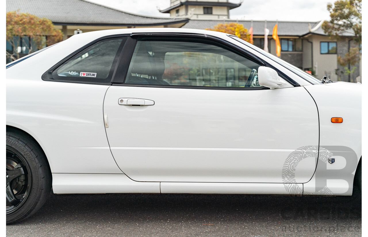 02/1999 Nissan R34 Skyline 25GT ER34 Series 1 2d Coupe QM1 White 2.5L - 04/2012 Import