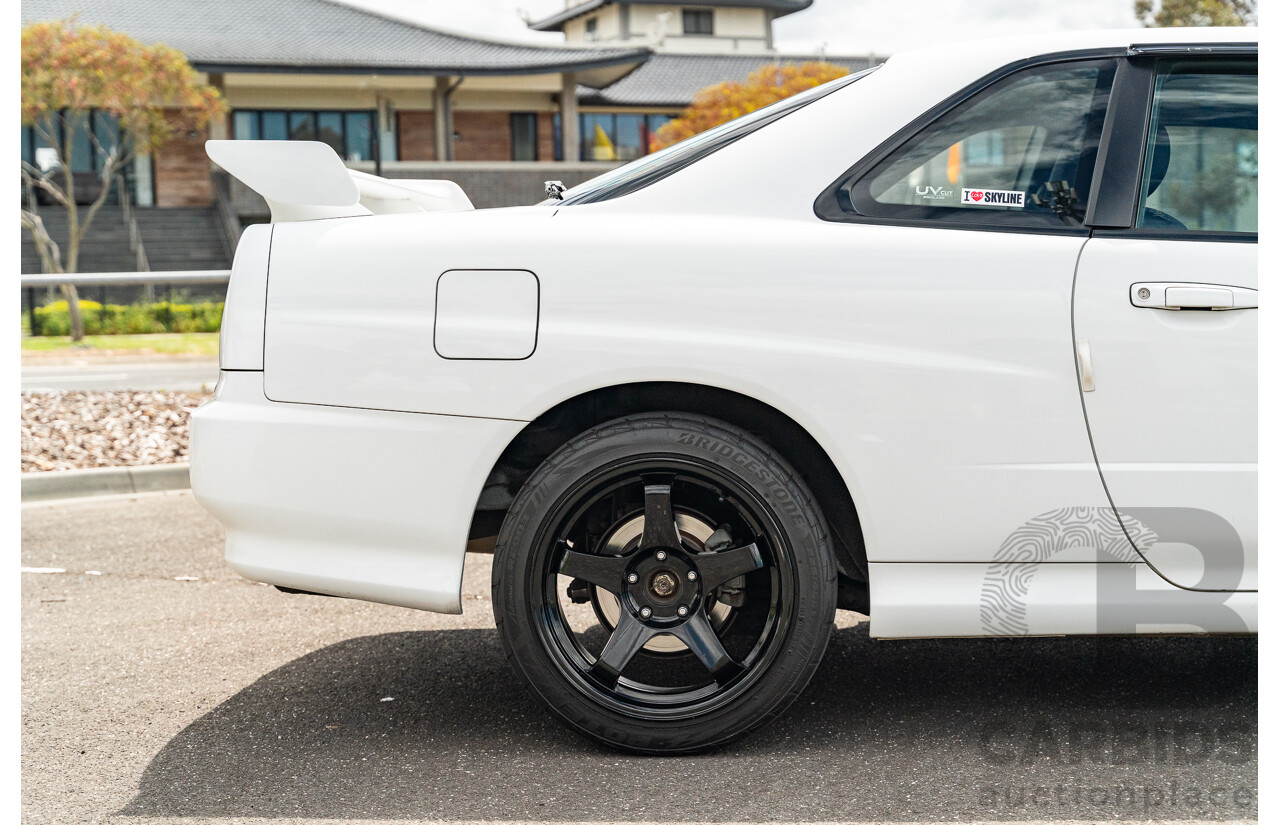 02/1999 Nissan R34 Skyline 25GT ER34 Series 1 2d Coupe QM1 White 2.5L - 04/2012 Import