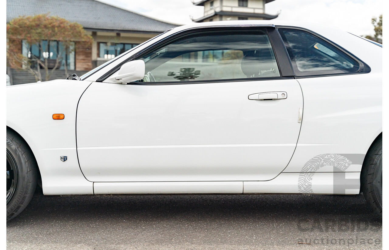 02/1999 Nissan R34 Skyline 25GT ER34 Series 1 2d Coupe QM1 White 2.5L - 04/2012 Import