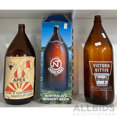 Two Bottles of NT Draught (One Empty) and a Victoria Bitter Draught Bottle