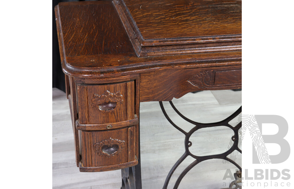 Singer Treadle Base Sewing Machine in Oak Cabinet