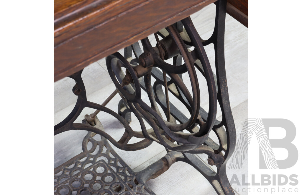 Singer Treadle Base Sewing Machine in Oak Cabinet