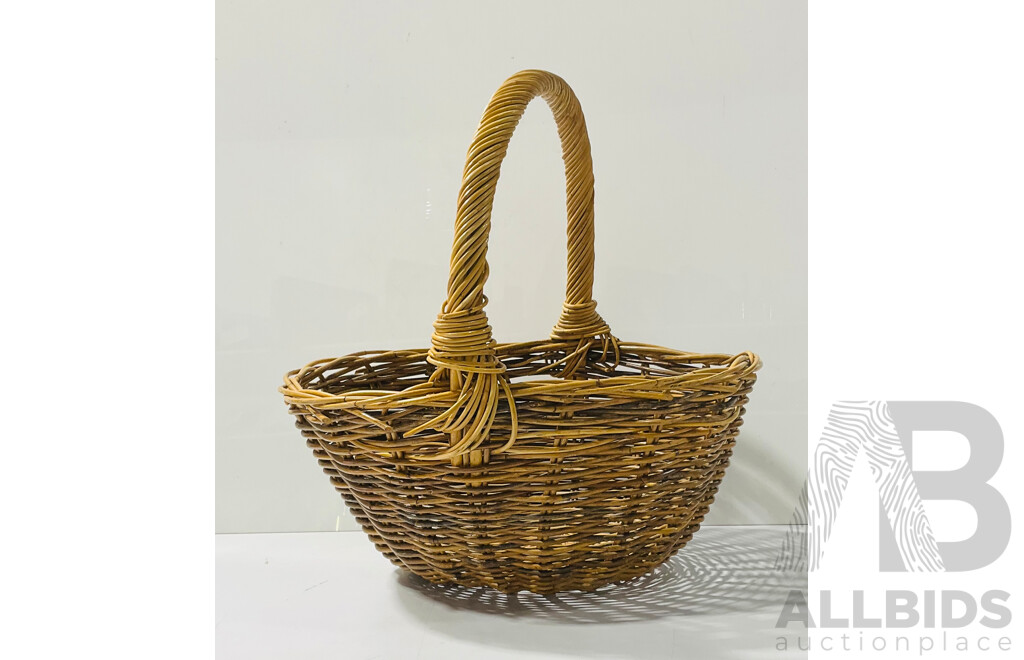 Vintage woven cane basket with handle