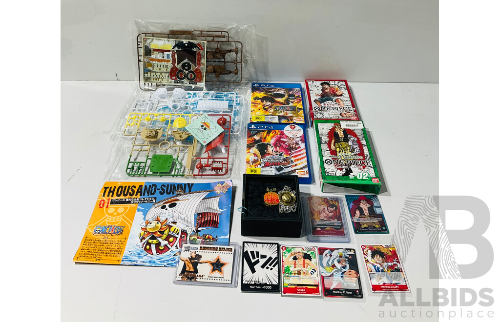 Collection of One Pice Memorabilia Including Thousand-sunny Buildable Model, Devil Fruit Pin and Straw Hat Necklace, Two One Piece Trading Card Game Starter Deck and More
