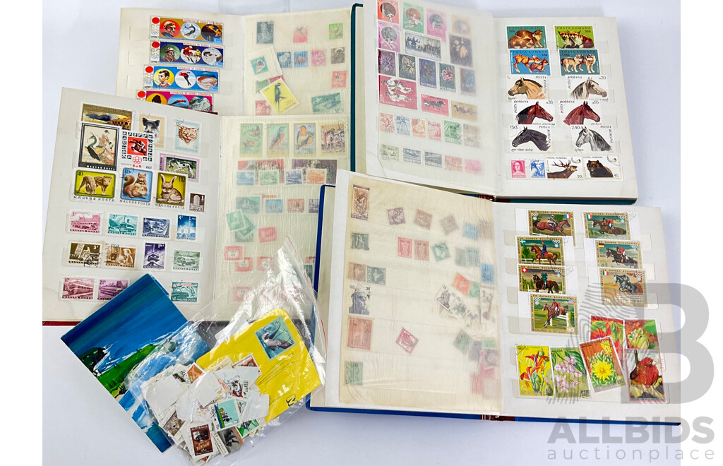 Four Albums of International Mint and Cancelled Stamps Including India, Germany, Rwanda, Australia, Cayman Islands, Magyar, USA, New Zealand, Fiji, Uruguay and More